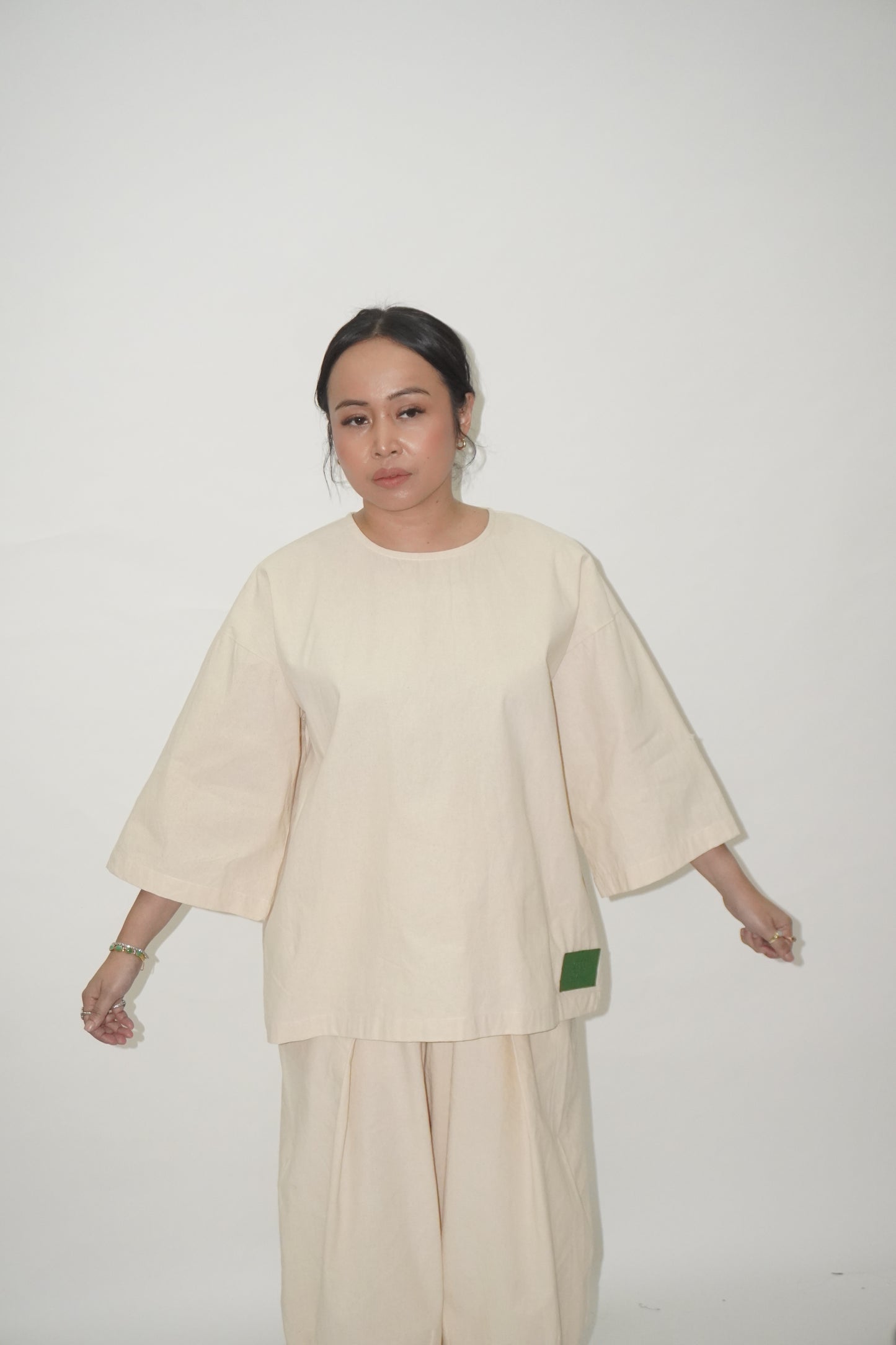 Baju Norma Beige TIGA-9